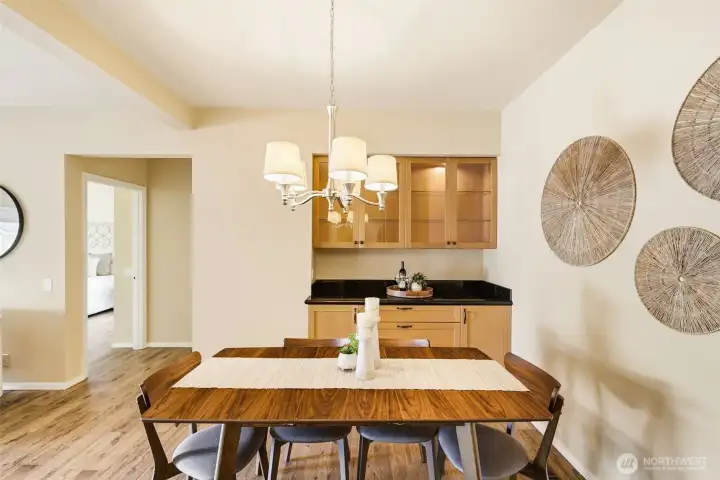 Elegant dining area featuring a built-in china hutch and serving space. Elegant dining area featuring a built-in china hutch and serving space.