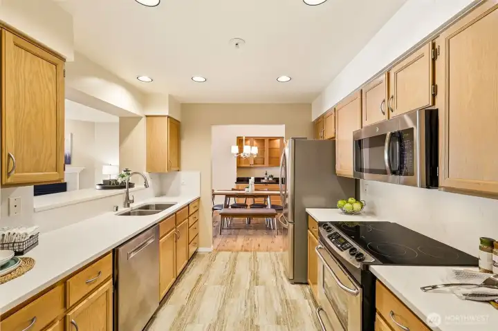 Updated kitchen with updated countertops and backsplash, stainless steel appliances, pantry, and breakfast bar. Updated kitchen with updated countertops and backsplash, stainless steel appliances, pantry, and breakfast bar.