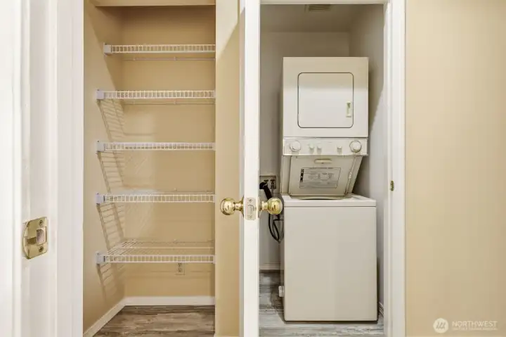 Convenient laundry area with adjacent open pantry shelving for additional storage and organization Convenient laundry area with adjacent open pantry shelving for additional storage and organization