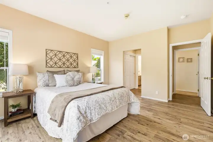 Spacious primary suite, abundant natural light, and direct access to the en-suite bath. Spacious primary suite, abundant natural light, and direct access to the en-suite bath.