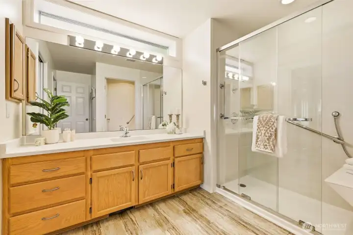 Primary bath features an oversized Jacuzzi walk-in shower, large vanity, and abundant storage. Primary bath features an oversized Jacuzzi walk-in shower, large vanity, and abundant storage.