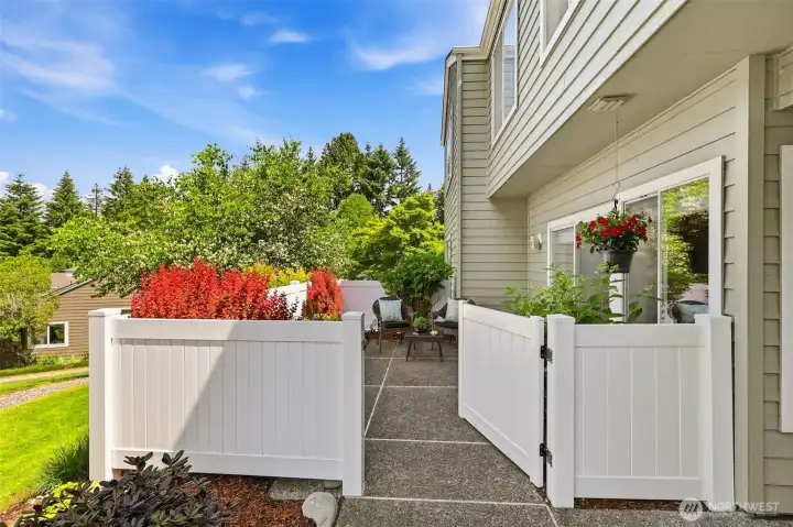 Spacious gated patio with room for outdoor seating and container gardening. Spacious gated patio with room for outdoor seating and container gardening.