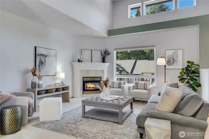 The cozy gas fireplace beautifully anchors the great room, creating a warm and inviting focal point.