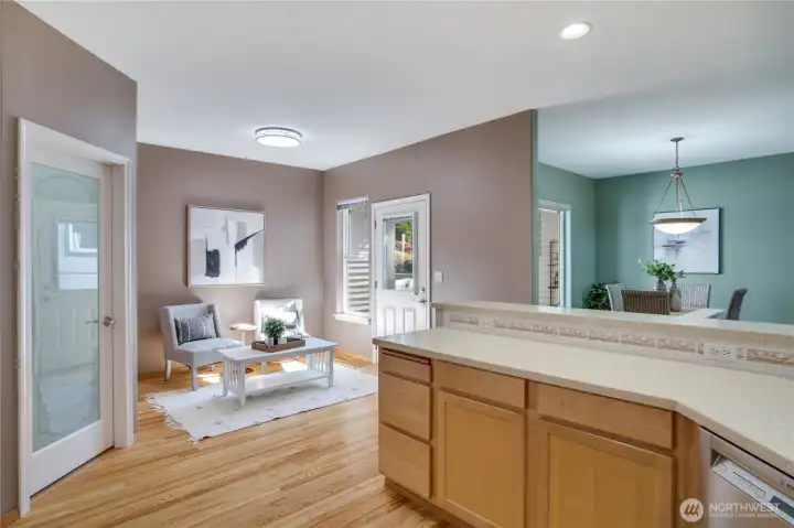 Designed for everyday ease, the breakfast bar is ideal for busy mornings, and the adjacent laundry/mudroom offers organized access to the attached garage