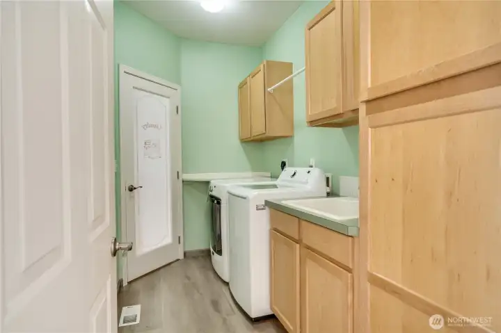 Laundry is a breeze with plenty of cabinet storage and a practical utility sink