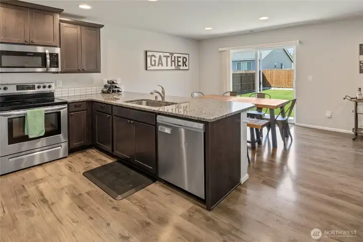 Kitchen- Dining room with slider to the back patio.