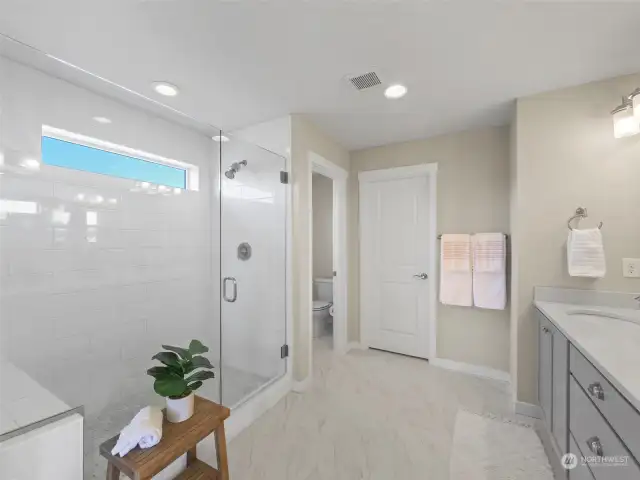 Frameless glass walk in shower.