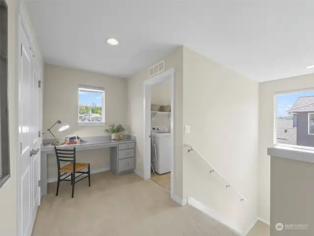 Upper landing with convenient laundry.