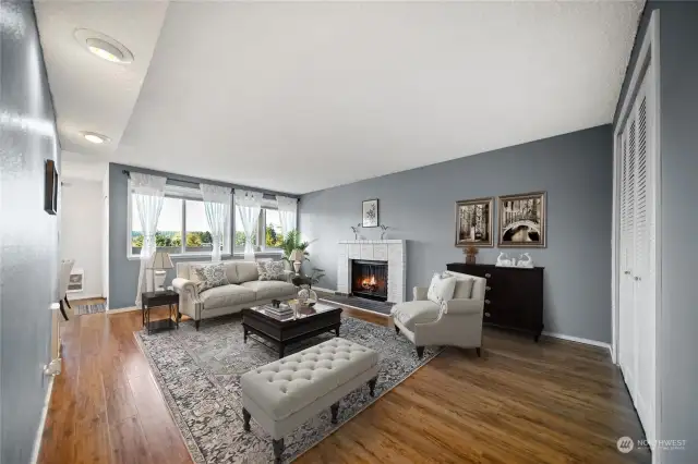 Virtually staged living room with wood fireplace