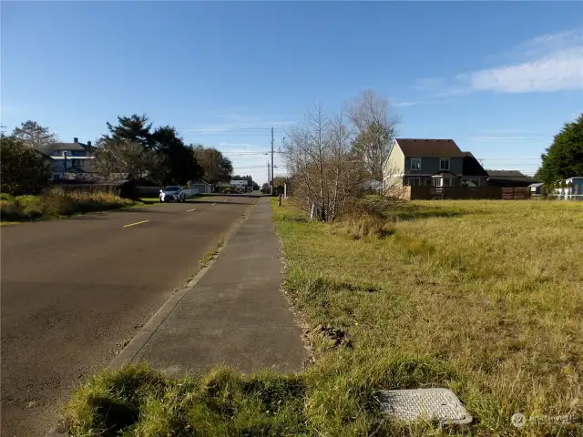 Sidewalk on north side of 3rd street looking west.