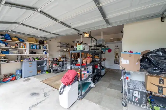 2-car garage with (removable) stair ramp. The laundry room is also housed inside its own space in the garage.
