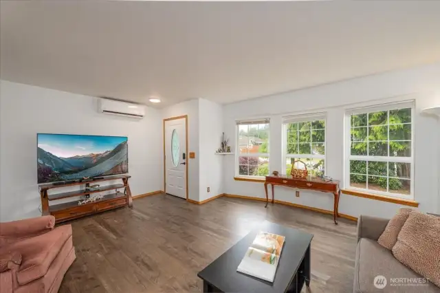 Spacious living room with bay window.