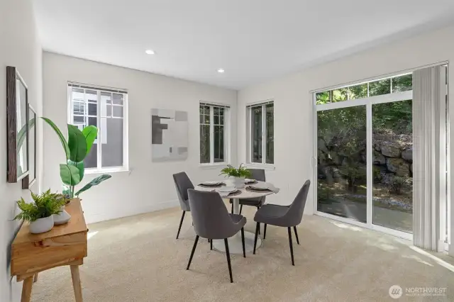 Dining area with direct access to the backyard space **Staged**