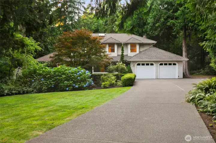 Grand front entry w/mature landscaping