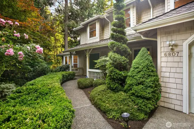 Grand front entry w/mature landscaping
