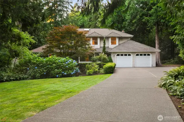 Grand front entry w/mature landscaping