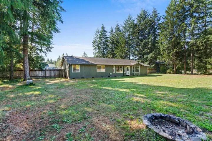 Huge Backyard with raised garden beds and firepit