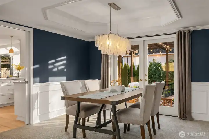 Formal Dining Room with Atrium Doors Leading to Outdoor Living Spaces