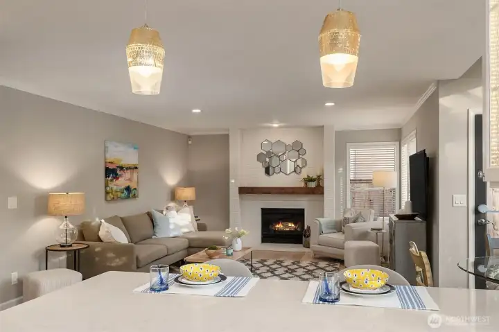 Open Floor Plan From Kitchen into Family Room Featuring a Wood Burning Fireplace
