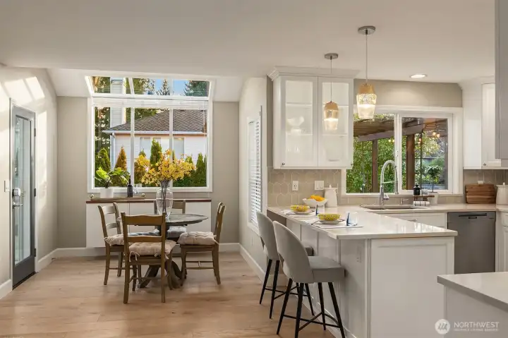 Sunlit Kitchen & Breakfast Nook with Solarium Windows & Engineered Hardwood Flooring