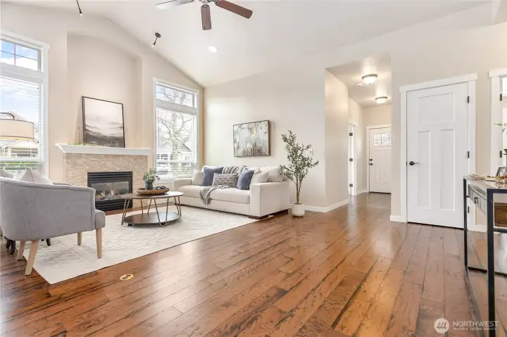 Nice open feel throughout living space. Coat closet through door ahead