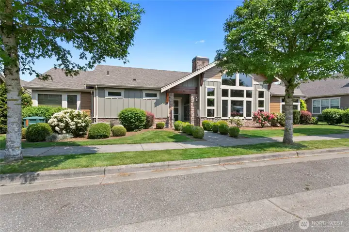 Front of clubhouse, short distance from subject home. Mailboxes accessed here.