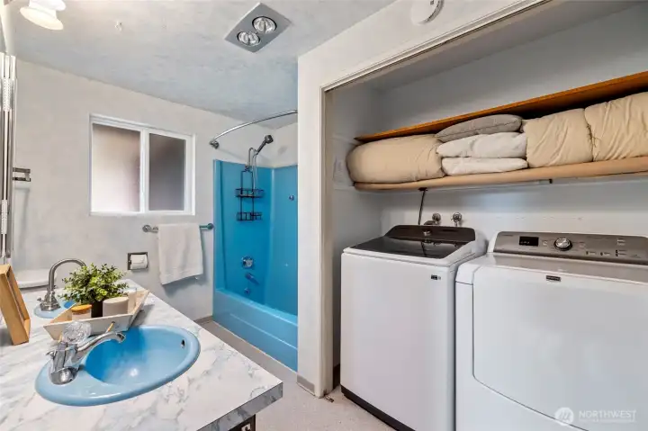 Primary ensuite with convenient laundry set up