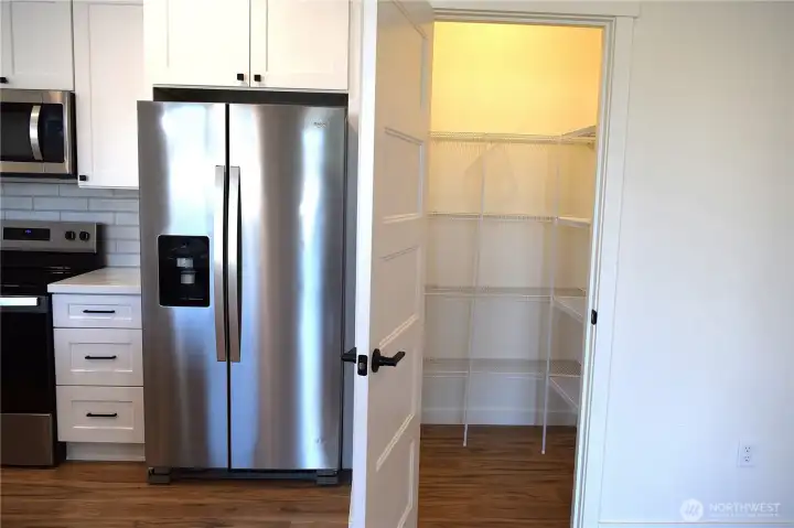 Walk in pantry with plenty of storage Walk in pantry with plenty of storage