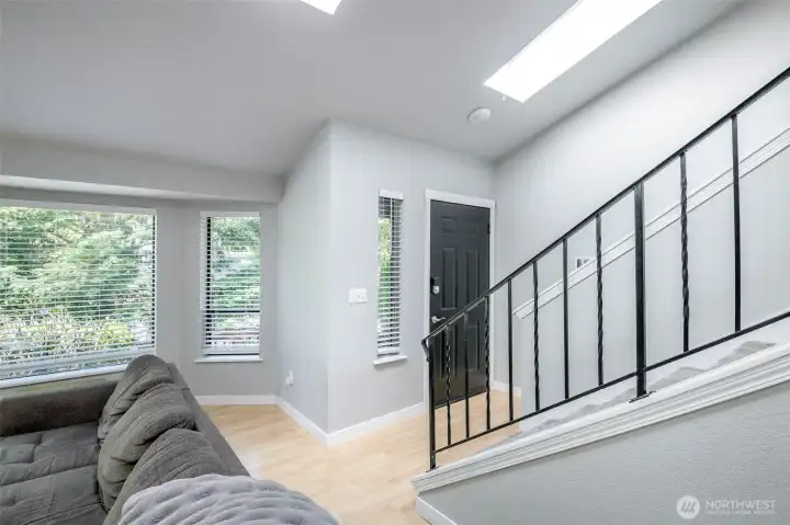 As you walk in front door, if you go straight down that is the bonus room, utility room and garage acesss. If you go up thats the kitchen area.