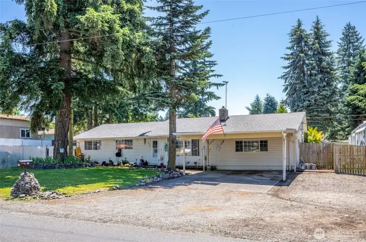 Single-level rambler on a spacious, fully fenced 15,000 SF lot.