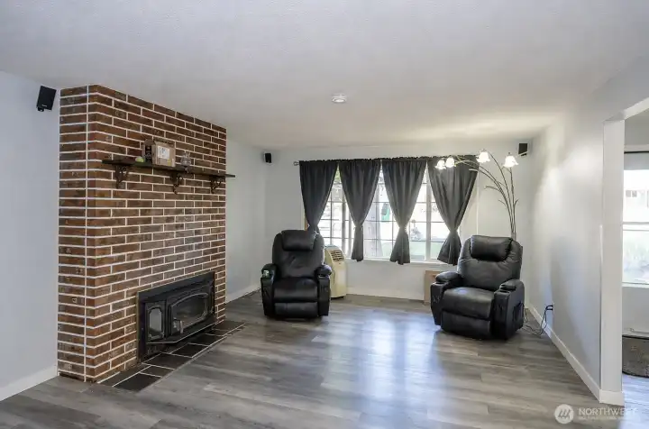 Comfortable living area featuring a pellet stove insert for added warmth and ambiance.