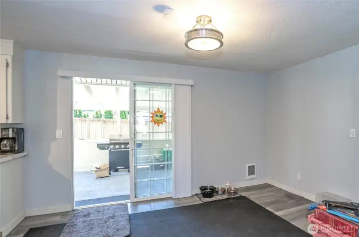 Dining area offering easy access to the back patio, ideal for effortless indoor-outdoor living.