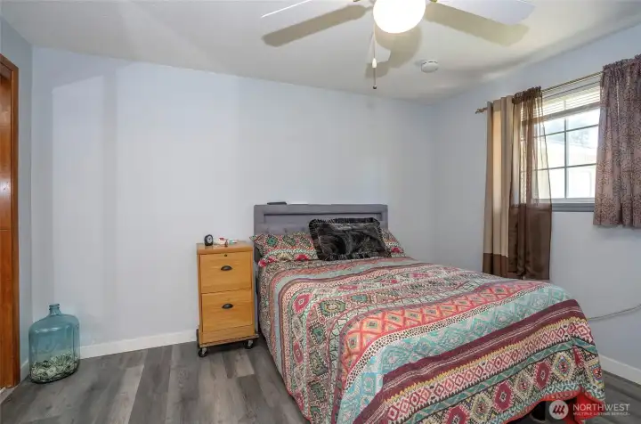 Primary suite enhanced with a ceiling fan for added comfort and airflow.