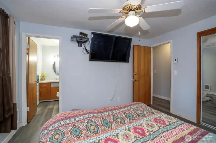 Primary suite includes a private half bath, offering added comfort and convenience.