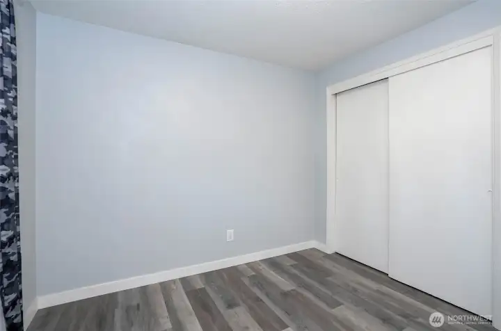 Another view of Guest suite #2 showcasing generous closet space and functional storage.