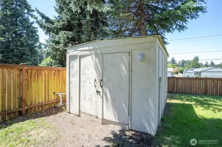10x12 shed housing a 10K generator and generator sub panel—ready for reliable backup power and peace of mind.