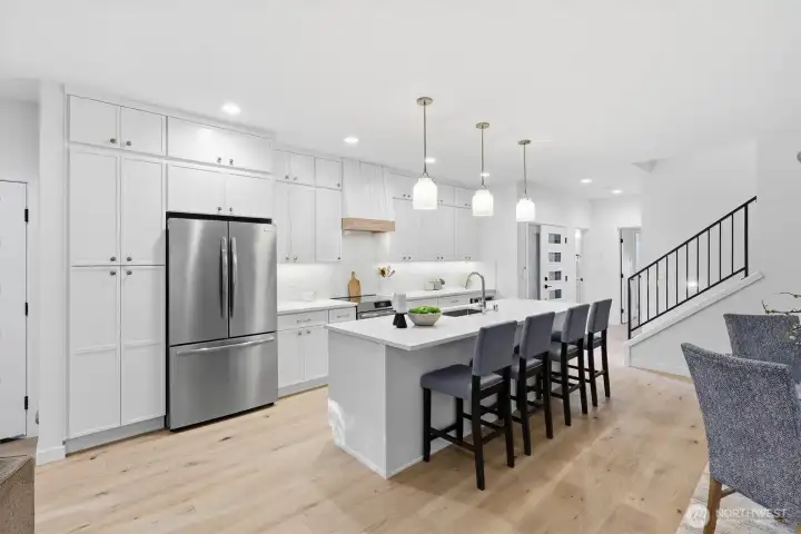 Large kitchen with oversized center island and lots of extra cabinet space. Large kitchen with oversized center island and lots of extra cabinet space.