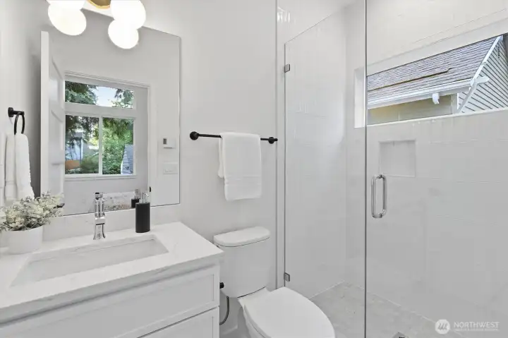 Private bathroom off of the main-floor guest suite. Private bathroom off of the main-floor guest suite.