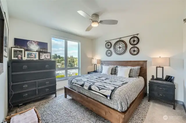 This is the Primary bedroom with a king sized bed and two large night stands. Both bedrooms have upgraded high-end brushed Nickle very quiet ceiling fans for added comfort.