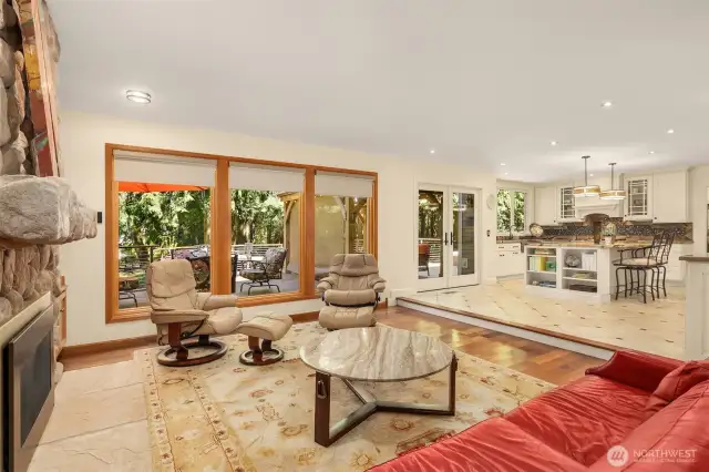 Enjoy the  family room’s built-in bookshelves. The fireplace and windows create a cozy, inviting atmosphere.
