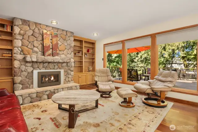 This family room is perfect for relaxing and unwinding. Its large picture windows provides unfettered view of deck and backyard. You'll find the room a delightful place to spend your leisure time.