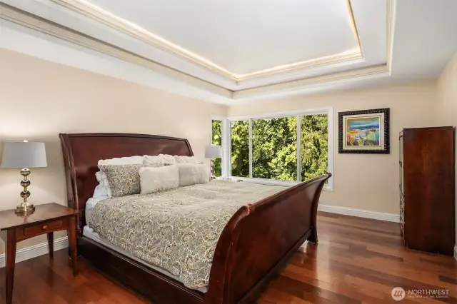 This beautiful primary suite is calling your name. Imagine relaxing here after a long day, either in the morning, evening or afternoon.