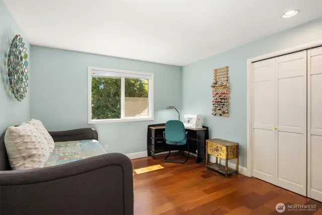 Morning sun lights this inviting bedroom.  Bright light from the window makes this room look cheerful and pleasant.