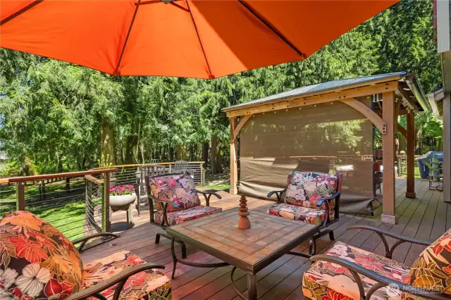 You will love the beauty of this custom IPE (Brazilian Ironwood) deck. It is constructed with high-quality materials and expert craftsmanship. Brazilian ironwood is not only one of the most beautiful, but also one of the strongest hardwoods in the world. It is resistant to rot, insects and decay, and it is incredibly durable and long-lasting. It's a great addition to your home, and it is sure to be enjoyed for many years to come.