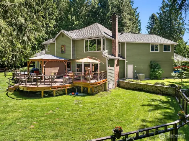 This home's expansive parklike setting creates a peaceful atmosphere, which is wonderful for outdoor enthusiasts and nature lovers.