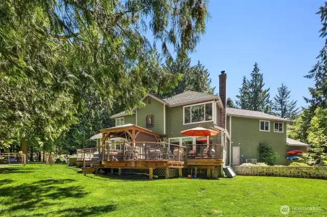 Imagine this to be a perfect place to enjoy the warm summer days and sunsets on a beautiful deck. The landscaping here is stunning. You could grill something, listen to some music, and spend hours talking and laughing.