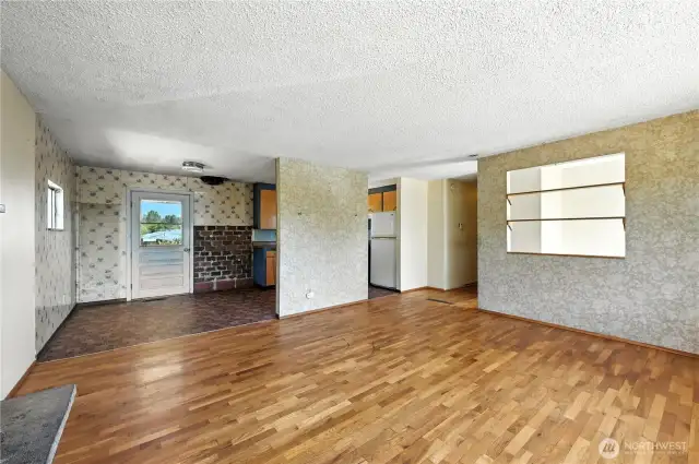 Living room looking into dining area and kitchen