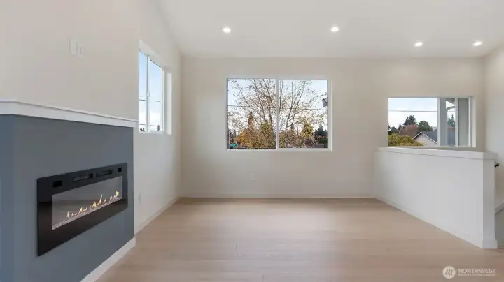 Great room with vaulted ceiling, easy care LVP flooring & lots of light.