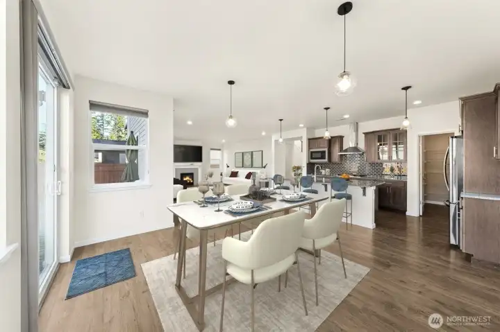 Virtually staged dining, kitchen, great room
