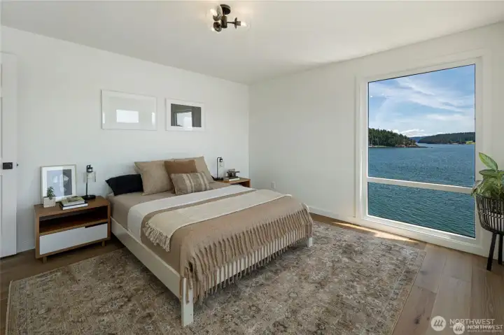 Wake up to panoramic views of Cayou Channel from this beautifully appointed bedroom with direct access to a private balcony. Large windows capture southwest light and create an airy, peaceful retreat.